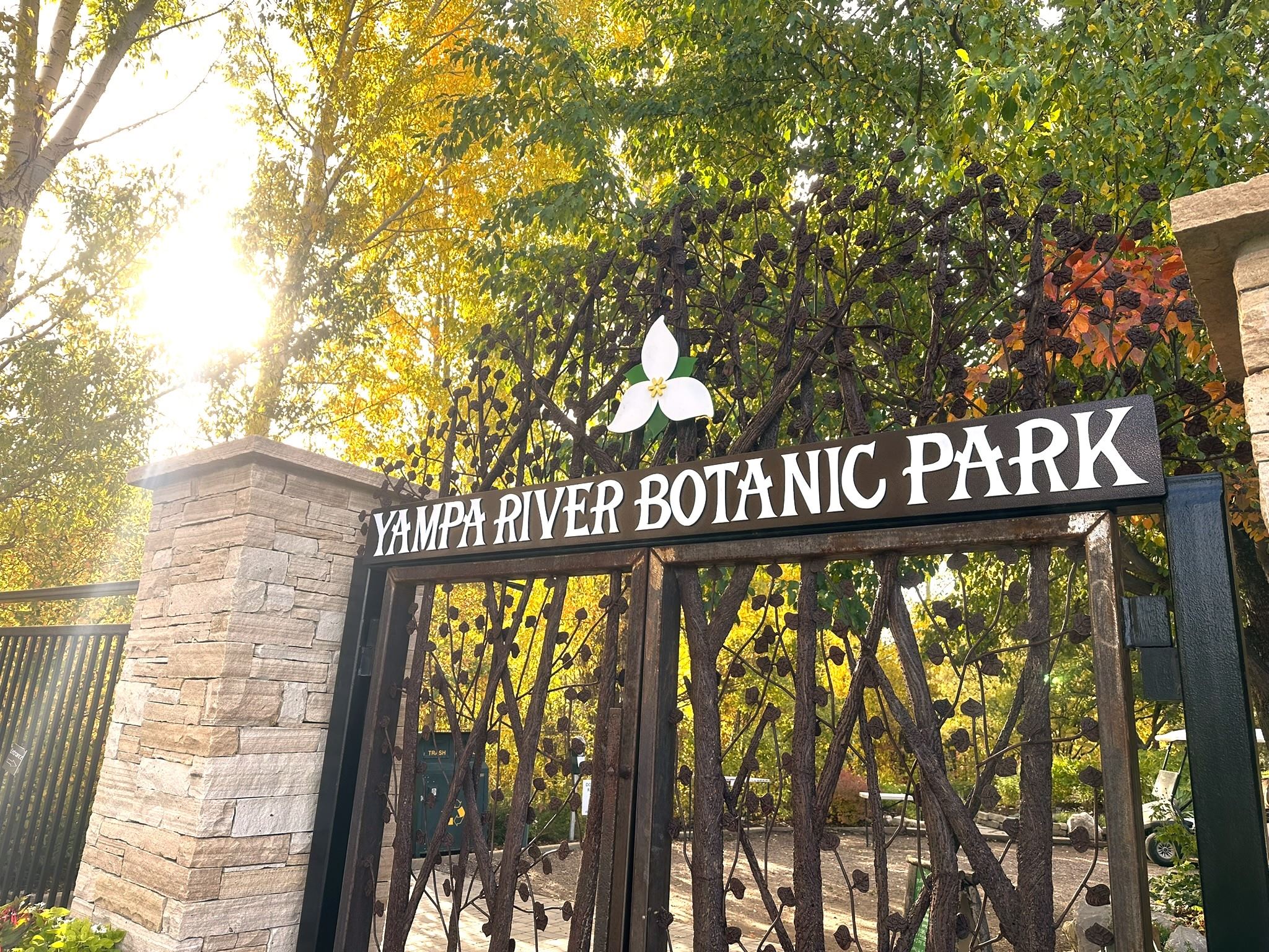 Autumn leaves sunshine entrance gate sign
