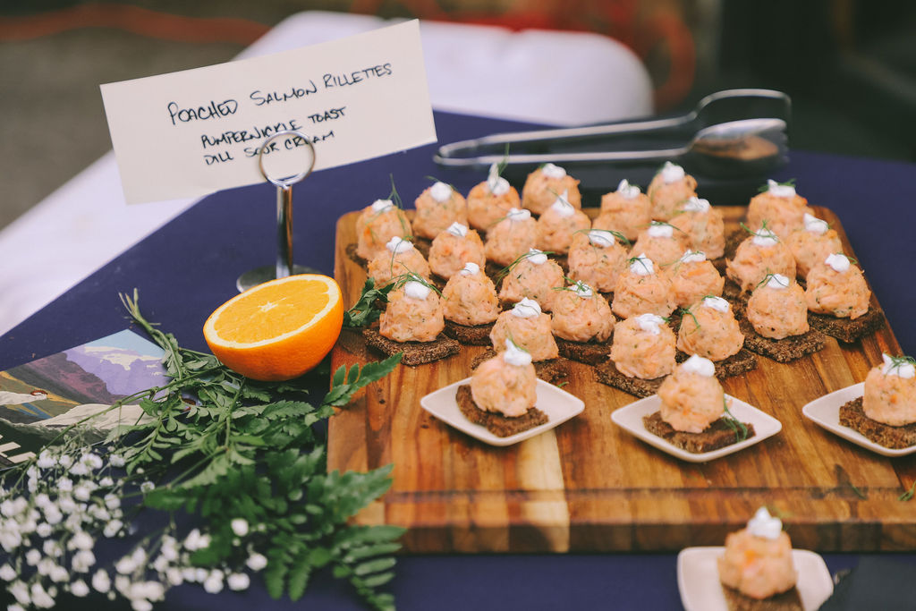 Salmon rillettes from La Central catering displayed on a wooden tray