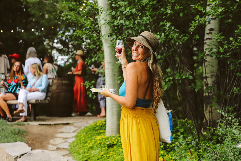 Woman holding up a glass of wine