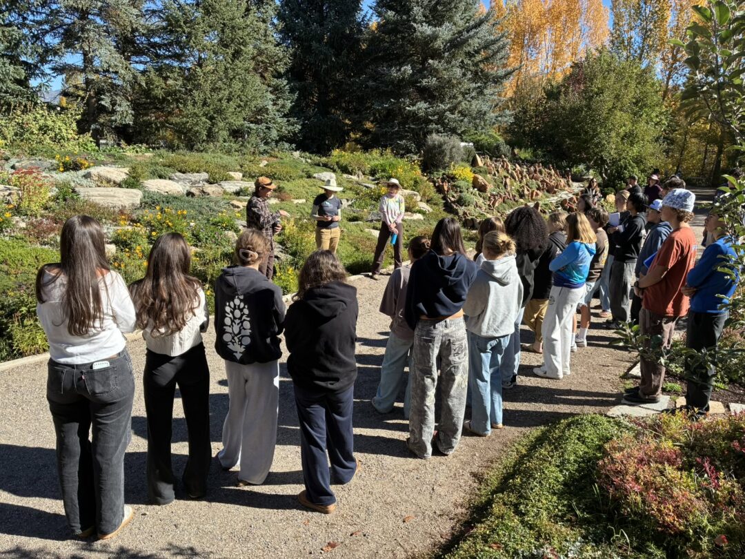 High school students listening to garden staff