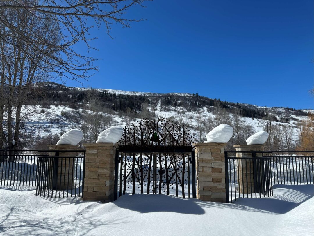 Snow piled atop the Core Trail entrance gate