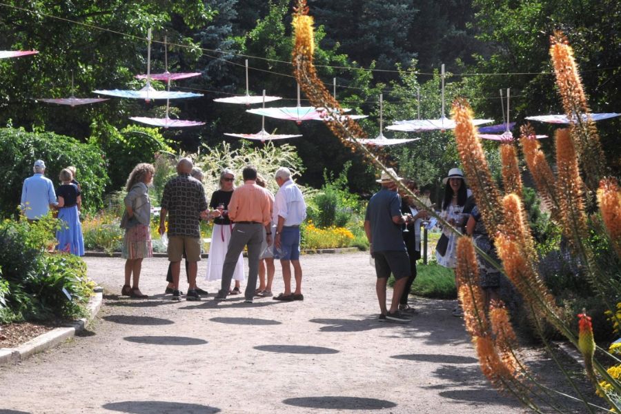 Group of men and women walking on dirt pathway during a tour.