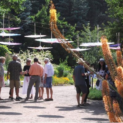 Group of men and women walking on dirt pathway during a tour.